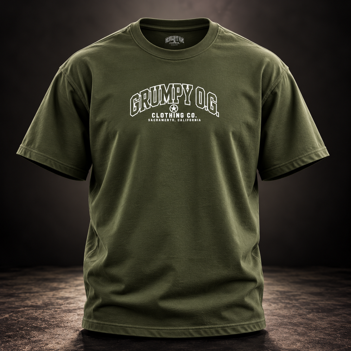 Military Green Grumpy O.G. Standard Tee featuring collegiate chest lettering and signature star emblem.