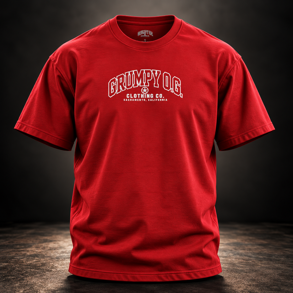 Red Grumpy O.G. Standard Tee featuring varsity-style chest lettering and signature star emblem.