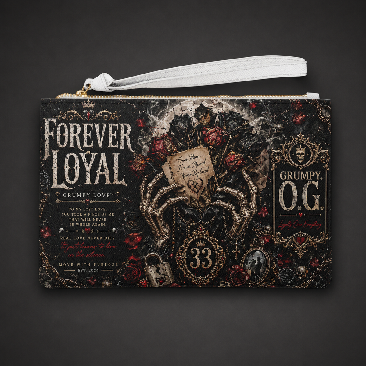 Forever Loyal™ Clutch featuring a dark romantic Grumpy Love™ design with skeleton hands, roses, gold accents and 33 dedication details.